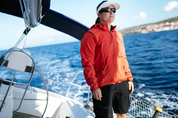 istock Attractive strong woman sailing with her boat 1127532065