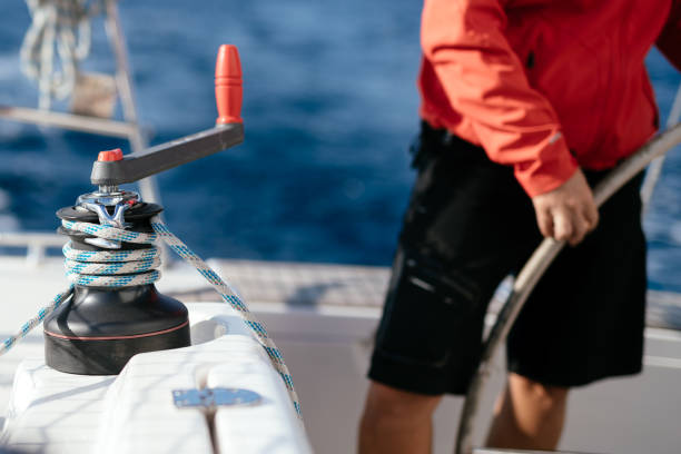 istock Attractive strong woman sailing with her boat 1127532120