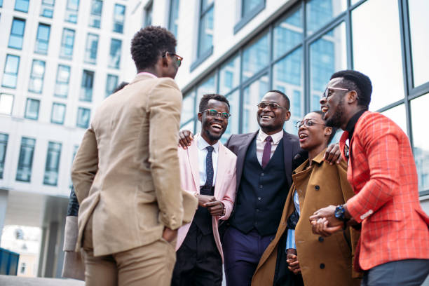 istock friendly business team talking on the street 1127533088