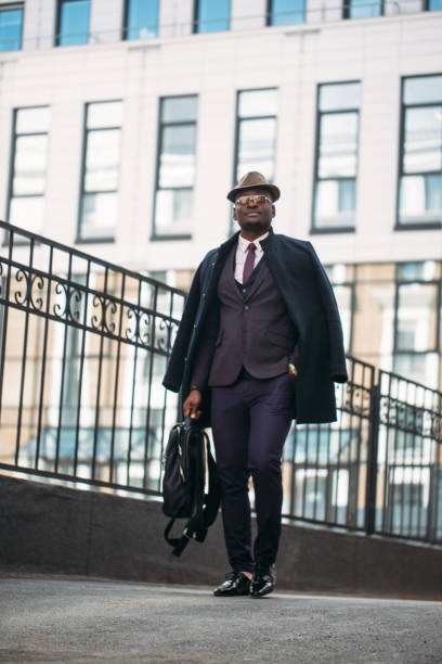istock dark skinned experienced businessman leaving the workplace 1127533102