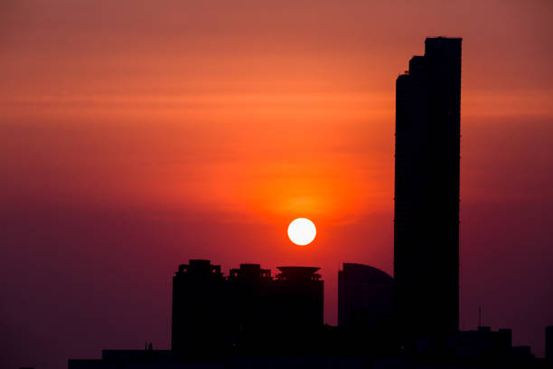 istock Sky with clouds over the evening city with sunset 1127533945