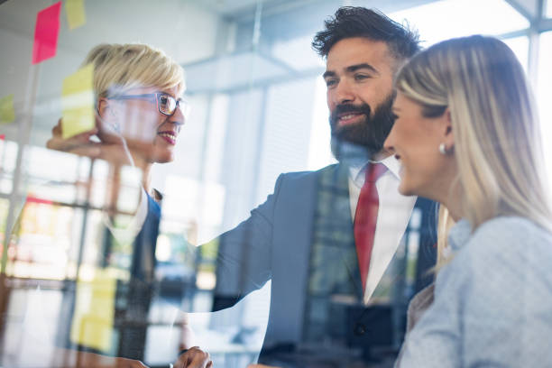 istock Collaboration and analysis by business people working in office 1127535714