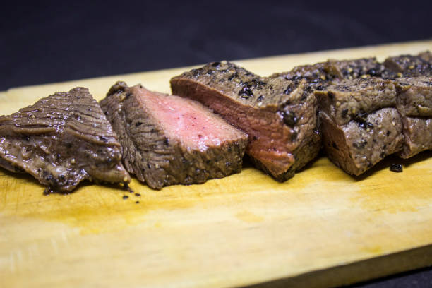 istock Medium roast steak on wooden plate 1127535917