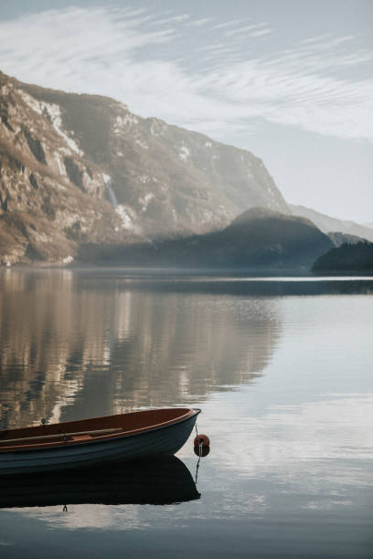 istock Tiny boat on still waters in Fjaerland, Norway 1127537575
