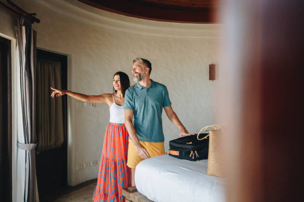 istock Honeymooners checking in to a hotel room 1127538876