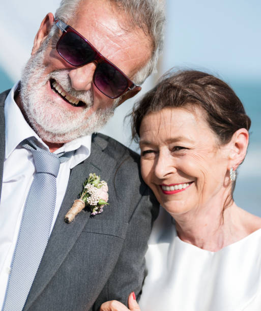 istock Senior couple getting married at the beach 1127540083