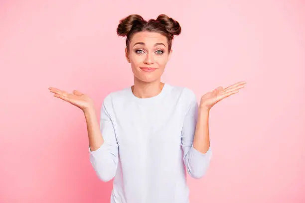 Photo of Portrait of nice-looking cute attractive winsome lovely funny cheerful cheery girl showing I don't know why what who when no idea gesture isolated over pink pastel background