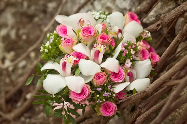 pink wedding bouquet with orchids and roses