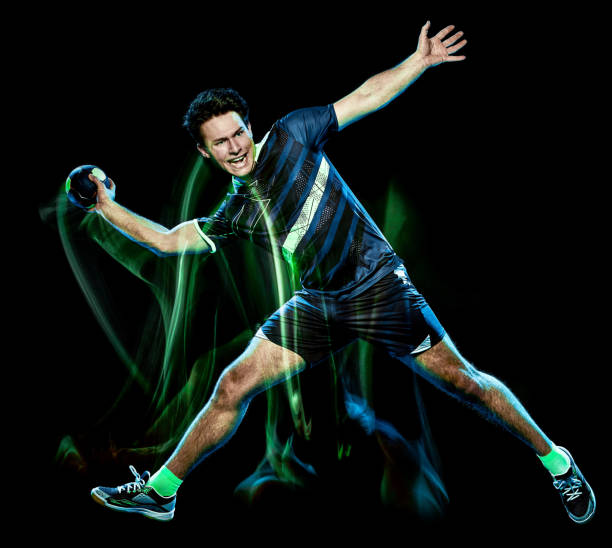 istock handball player young man isolated speed light painting 1127541872