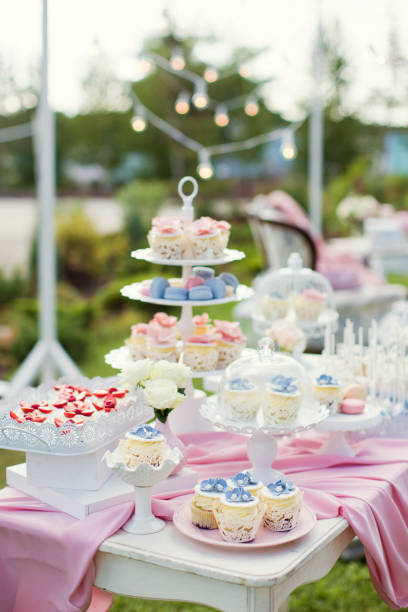 istock Candy bar with blue, pink and white cupcakes, macaroons and cake pops 1127544113