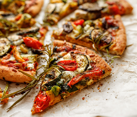 Vegetarian pizza with addition grilled vegetables and aromatic herbs
