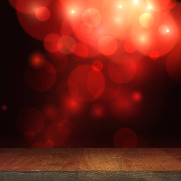 istock Wooden top table stage with blurred bokeh background, empty wooden table with a festive background 1127544485