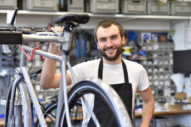 istock portrait of a young bicycle mechanic in the workshop 1127544663