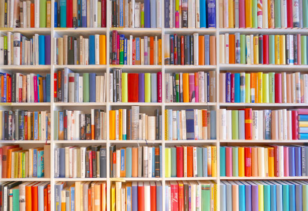 Large books shelves fully packed Endless white books shelves fully packed bookshelf stock pictures, royalty-free photos & images