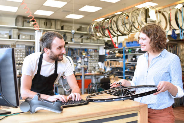 istock Bicycle shop consulting - salesman and customer in conversation 1127545389