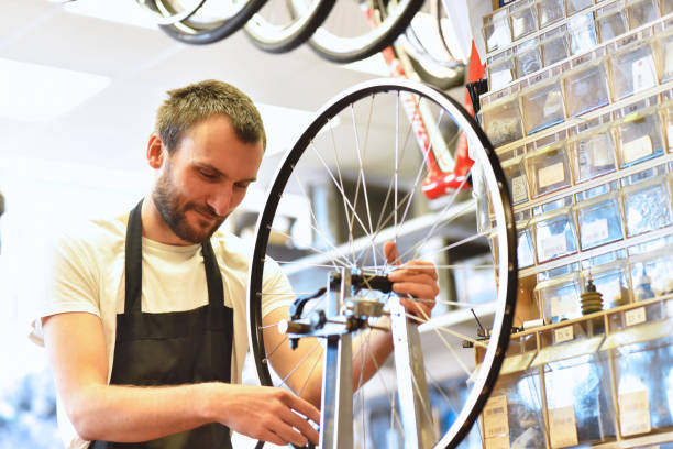 istock portrait of a young bicycle mechanic in the workshop 1127546204