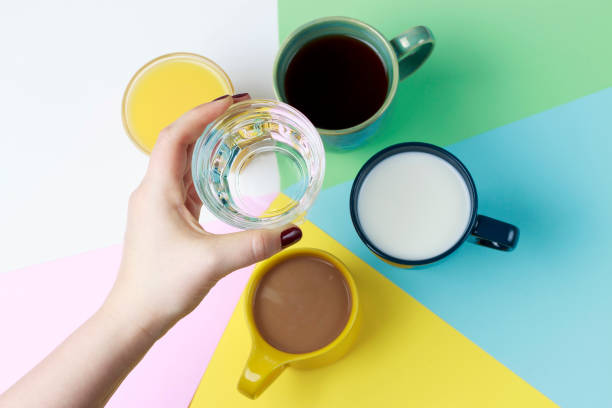 istock Coffee tea and other drinks in colorful cups on a white background, top view 1127549260