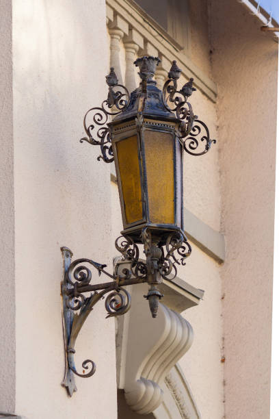 istock Steel retro lantern on the outer wall of the building. Architect 1127550354