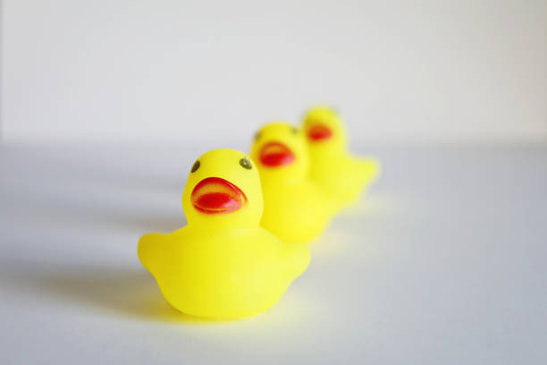 istock Competition yellow rubber duck leadership business concept 1127550621