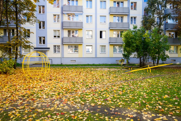 istock Old children playground by modern apartment house 1127551043