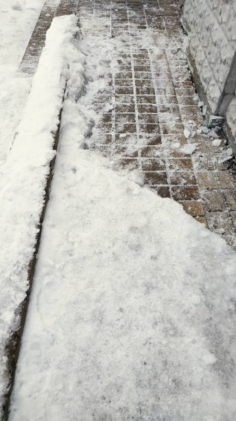 istock Snow with ice on paving slabs 1127552497