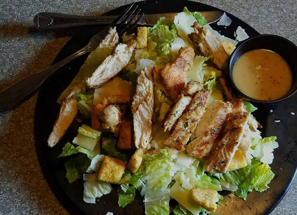 istock Top View, Classic Caesar Salad With Grilled Chicken 1127552854