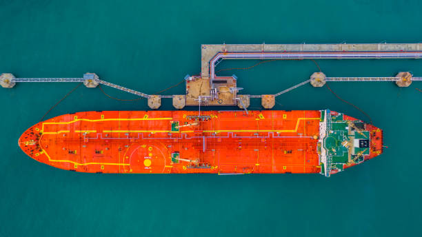 istock Tanker ship loading in port view from above, Tanker ship logistic import export business and transportation, Aerial view. 1127556386