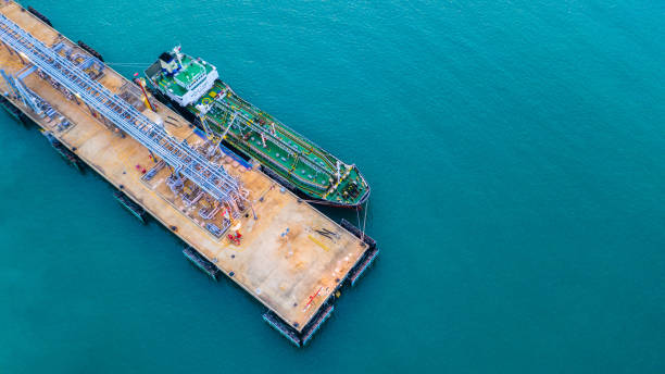 istock Tanker ship loading in port view from above, Tanker ship logistic import export business and transportation, Aerial view. 1127556429