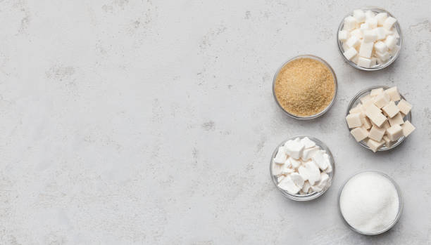 istock Various kinds of sugar cubes, pieces ands sand 1127558925