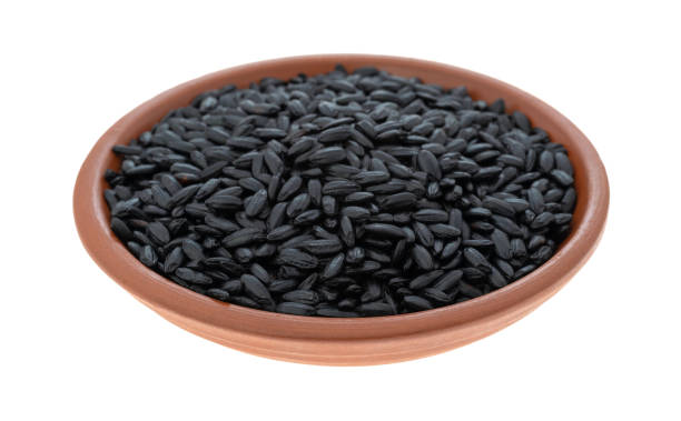 istock Black rice in a small bowl on a white background 1127558954