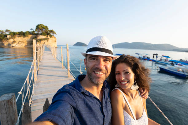 istock Cheerful young couple on a bridge 1127561096