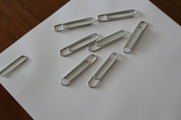 white background and paperclip white background and paperclip düzenlenme stock pictures, royalty-free photos & images