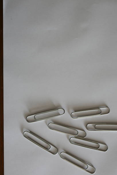 white background and paperclip white background and paperclip düzenlenme stock pictures, royalty-free photos & images