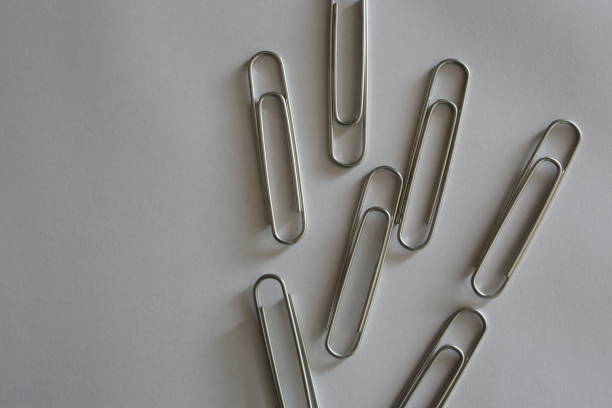 white background and paperclip white background and paperclip düzenlenme stock pictures, royalty-free photos & images