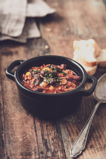 istock Tasty Hot Chili con carne stew with fresh herbs 1127563273