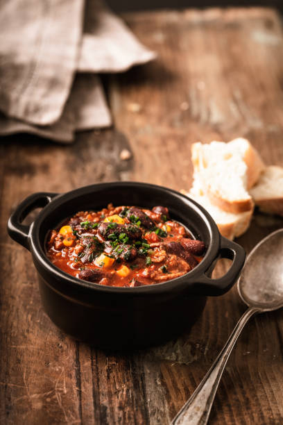 istock Tasty Hot Chili con carne stew with fresh herbs 1127563276