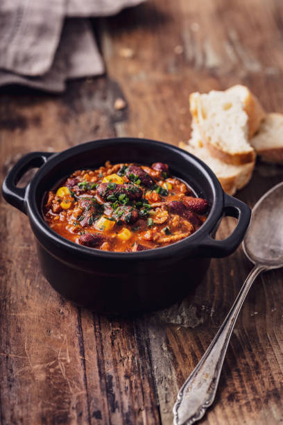 istock Tasty Hot Chili con carne stew with fresh herbs 1127563287