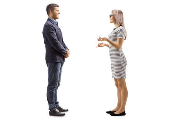 istock Young man and woman standing and having a conversation 1127564545