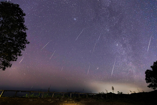 Geminid Meteor Shower and the Milky Way Over a mountain. Geminid Meteor in the night sky