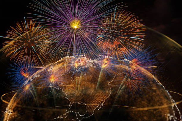 istock Multicolor Firework Celebration over the Part of Abstract planet earth particle background, Independence day concept 1127565471