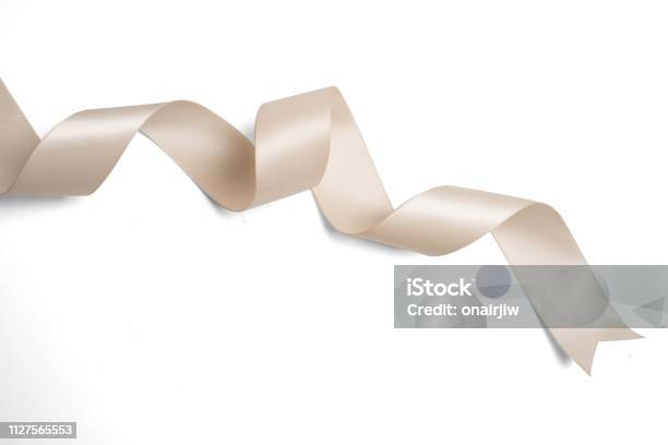 Cream Ribbon In Roll On White Background Stock Photo - Download Image Now -  Ribbon - Sewing Item, Cream - Dairy Product, Celebration - iStock