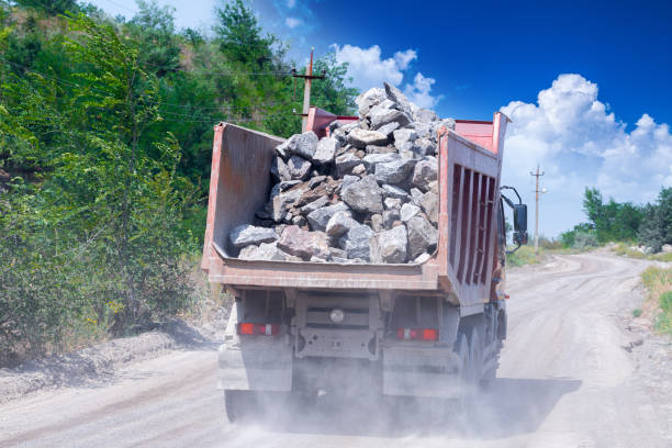 istock A dump truck loaded mined granite in a quarry open pit mining of granite stone. Process production stone and gravel. Quarry mining equipment. 1127566268