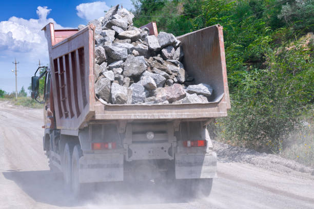 istock A dump truck loaded mined granite in a quarry open pit mining of granite stone. Process production stone and gravel. Quarry mining equipment. 1127566282