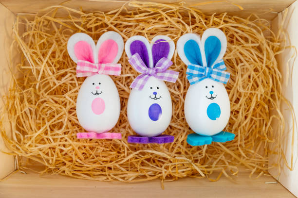 istock Easter rabbit and eggs with colorful eggs around and white background 1127567967