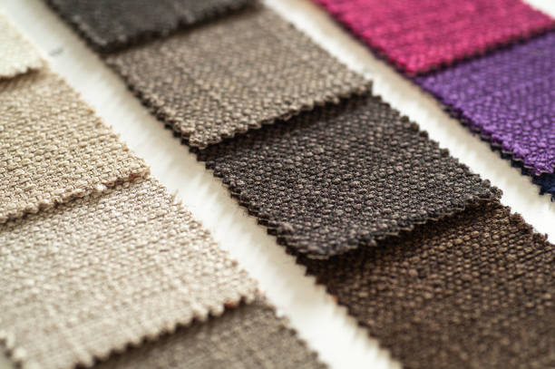 istock Catalog of multicolored cloth from matting fabric texture background, silk fabric texture, textile industry background 1127568594