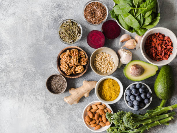 healthy clean food - vegetables, fruits, nuts, superfoods on a gray background. healthy eating concept. top view. - base comida e bebida imagens e fotografias de stock