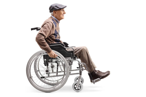 Handsome senior male wheelchair user enjoying his free time on a beach holiday in the Netherlands