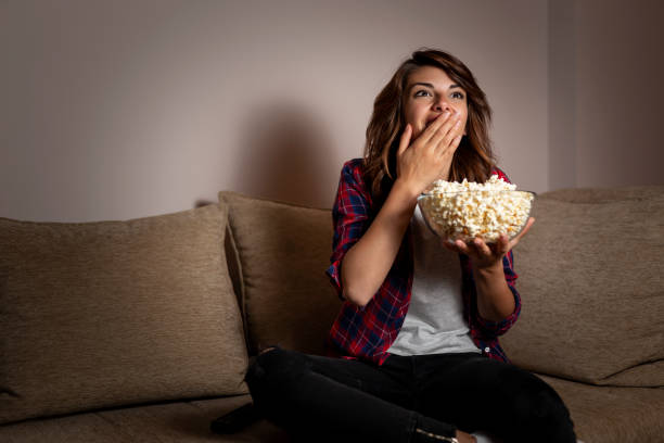 istock Woman watching TV 1127572741