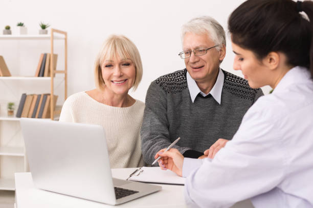 istock Elderly couple discussing treatment plan with doctor 1127572908