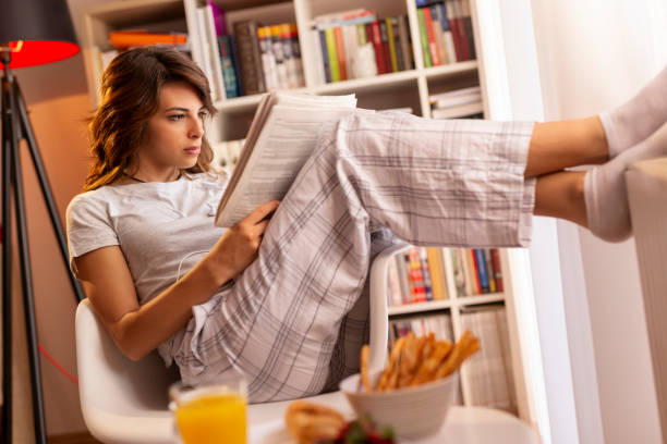 istock Woman reading the newspapers 1127573133